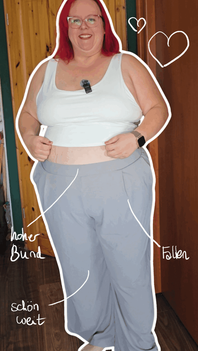 Dicke rothaarige Frau trägt eine weite hellgraue Hose, deren Eigenschaften auf dem Bild beschrieben werden