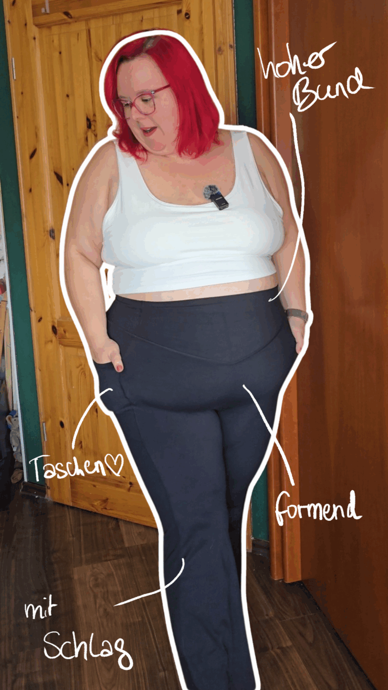 Dicke rothaarige Frau trägt eine formende schwarze Leggings mit weitem Bein, deren Eigenschaften auf dem Bild beschrieben werden